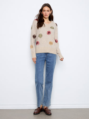 Featuring long sleeves, this sweater is designed for comfort and style, making it an ideal choice for cooler days. By Charlie B.