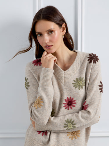 With its eye-catching floral embroidery, this V-neck sweater is both stylish and comfortable for everyday wear. By Charlie B.
