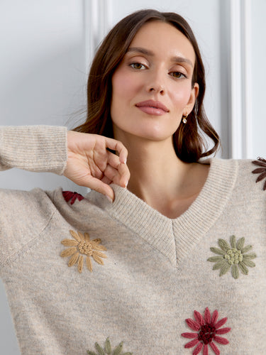 Designed with long sleeves, this elegant sweater offers both warmth and style in one beautiful package. By Charlie B.