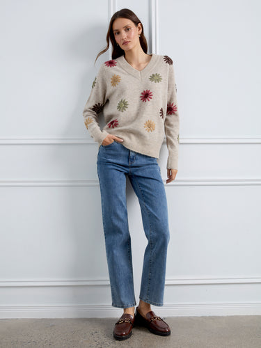 The intricate floral embroidery on this soft knit sweater adds charm and character to your ensemble. By Charlie B.