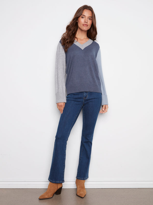 Moonlight sweater showcasing wide cuffs with a chic colorblock design by Charlie B.
