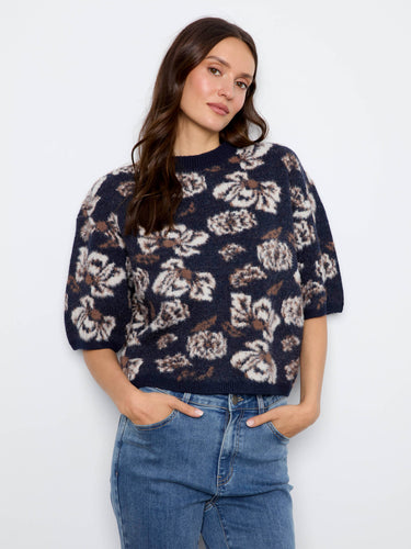 Floral knit sweater featuring a cozy mock neck, perfect for cooler days. By Charlie B.