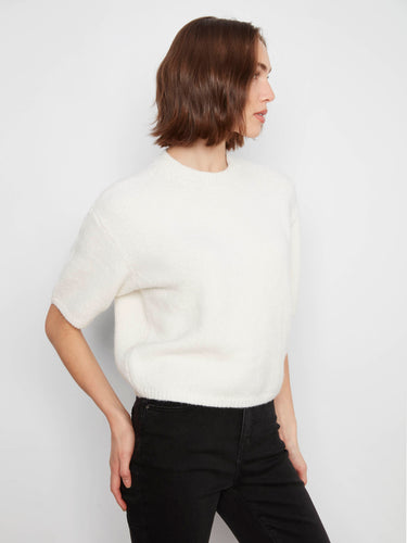 This versatile sweater combines fashion-forward details with comfort, making it an essential piece for every closet by Charlie B.