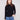 Elegant black sweater with a chic mock neck, paired with casual blue jeans for a stylish look by Charlie B.