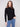 Sophisticated black sweater featuring textured fabric, perfectly matched with blue jeans by Charlie B.