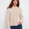 Heather oat sweater featuring a cozy mock neck and wide cuffs, perfect for relaxed styling by Charlie B.