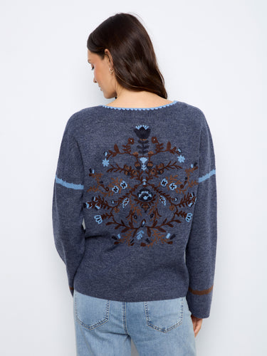 An exquisite embroidered back design adds elegance to this cozy sweater, making it a standout piece by Charlie B.
