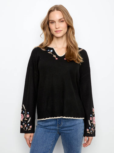 Black ribbed sweater with drop shoulders and floral embroidery on the sleeves by Charlie B.