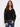 Black sweater featuring a drop shoulder design and white embroidery accents for a stylish look by Charlie B.
