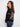 Elegant black sweater with ribbed texture and intricate white embroidery on the back by Charlie B.