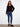 Chic black sweater showcasing an embroidered back design and relaxed fit for casual elegance by Charlie B.