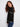Sophisticated sweater in black with drop shoulders and unique white embroidery detailing by Charlie B.