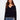 Navy sweater with drop shoulders and delicate white trim detail, creating a casual yet stylish look by Charlie B.