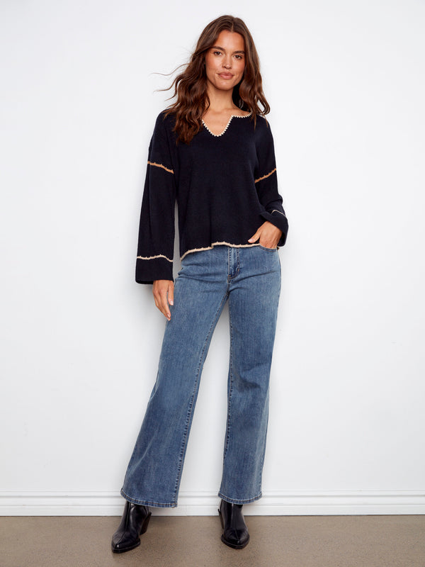 Relaxed fit navy sweater with subtle ribbed texture, perfect for comfort and style in casual settings by Charlie B.