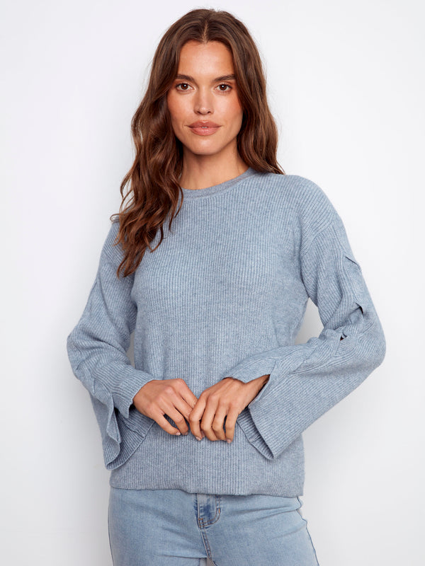 Heather denim sweater featuring drop shoulders and a relaxed fit for casual elegance by Charlie B.