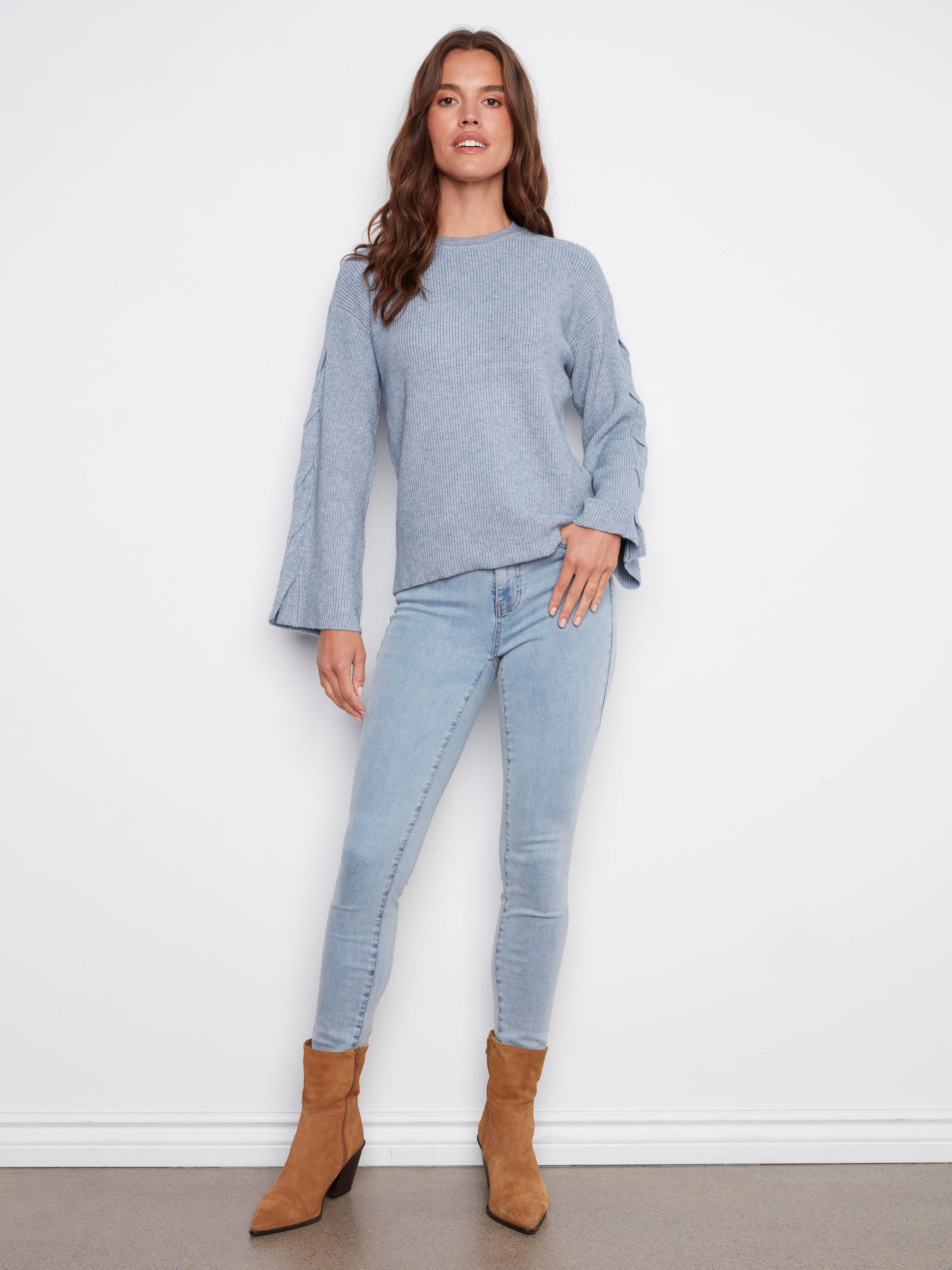 Comfortable crew neck design in heather denim, perfect for layering or standalone wear by Charlie B.