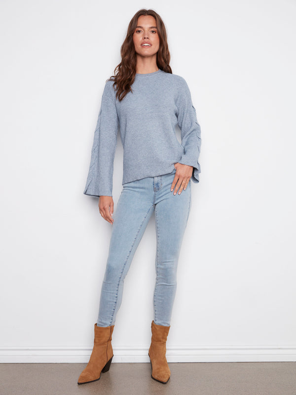 Comfortable crew neck design in heather denim, perfect for layering or standalone wear by Charlie B.