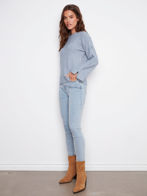 Chic heather denim sweater crafted with attention to detail, including stylish cable accents by Charlie B.