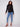Chic black sweater with ribbed neck, hem, and cuffs for a cozy fit by Charlie B.