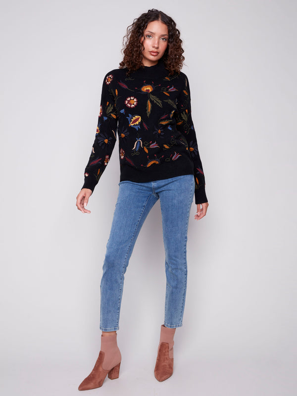 Chic black sweater with ribbed neck, hem, and cuffs for a cozy fit by Charlie B.