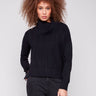 Black sweater featuring drop shoulders and chevron pattern, adding a relaxed fit by Charlie B.