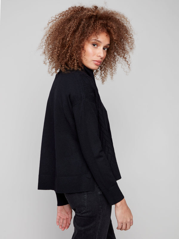 Stylish black sweater with ribbed cuffs and elegant chevron design by Charlie B.