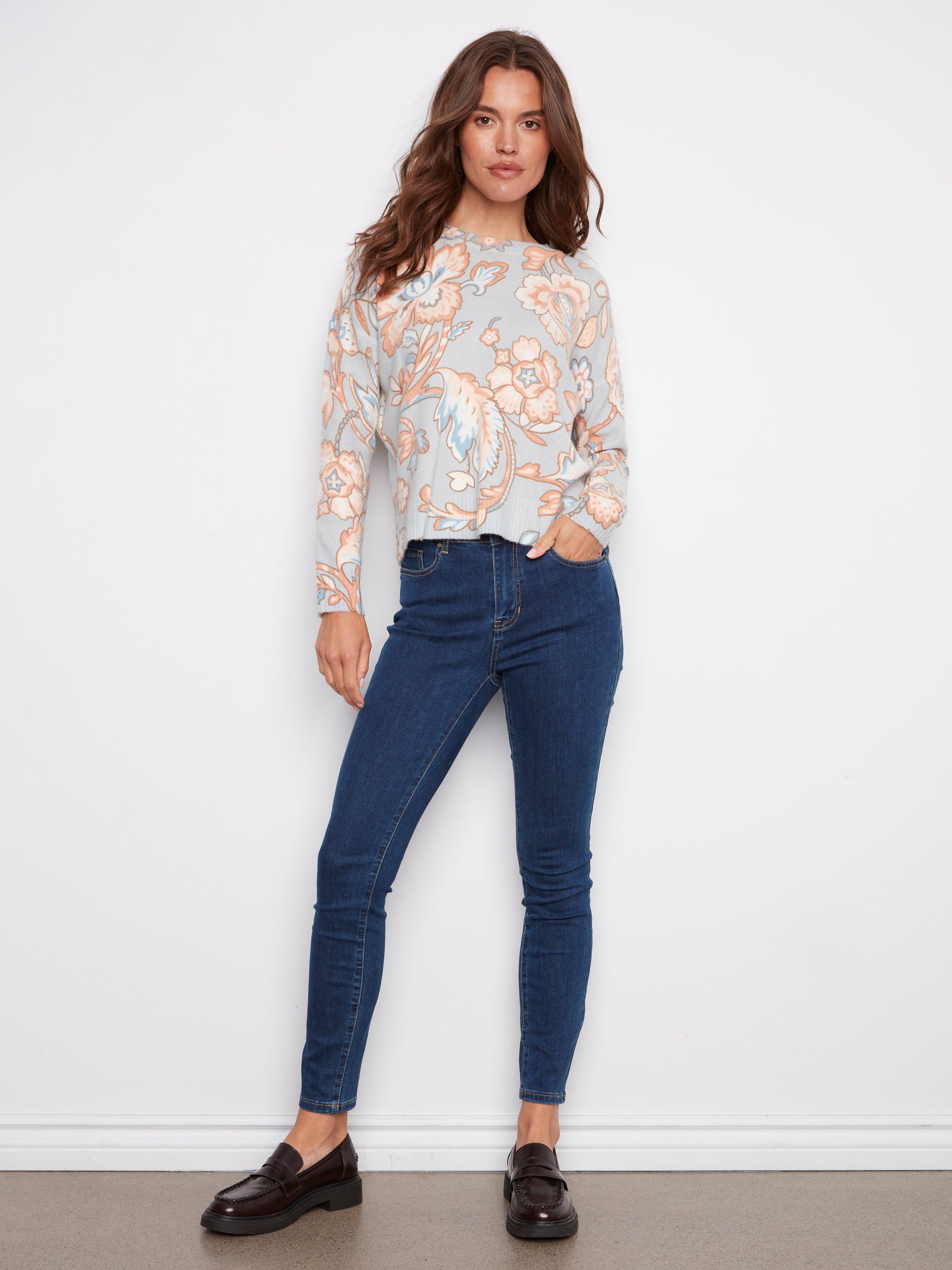 Stylish floral printed sweater showcasing ribbed cuffs and hem for added texture by Charlie B.
