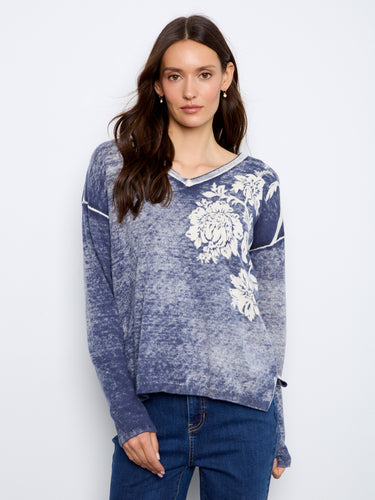 Stylish V-neck sweater featuring a unique reversible print, crafted from a soft cotton blend for ultimate comfort. By Charlie B.
