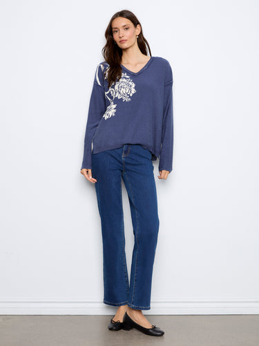 Fashionable long sleeve sweater in a premium cotton blend, designed with an eye-catching V-neck style. By Charlie B.