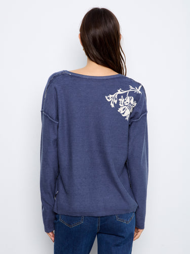 A must-have V-neck design that combines the softness of cotton blend with modern fashion elements effortlessly. By Charlie B.