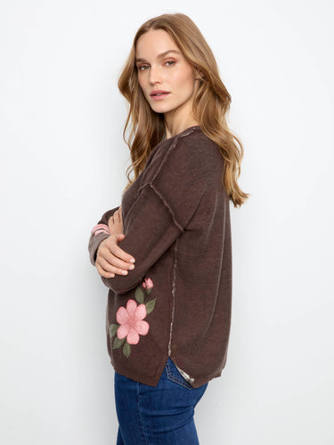 Fashionable drop shoulder design complements the vibrant floral motifs on this soft cotton blend piece by Charlie B.