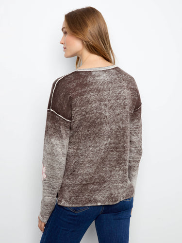 Cozy long-sleeve sweater in a stylish V-neck cut, embellished with lovely flower prints for added flair by Charlie B.
