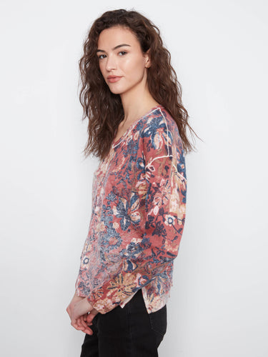 Vibrant colors and patterns make this reversible print top a standout piece for any wardrobe collection. By Charlie B.