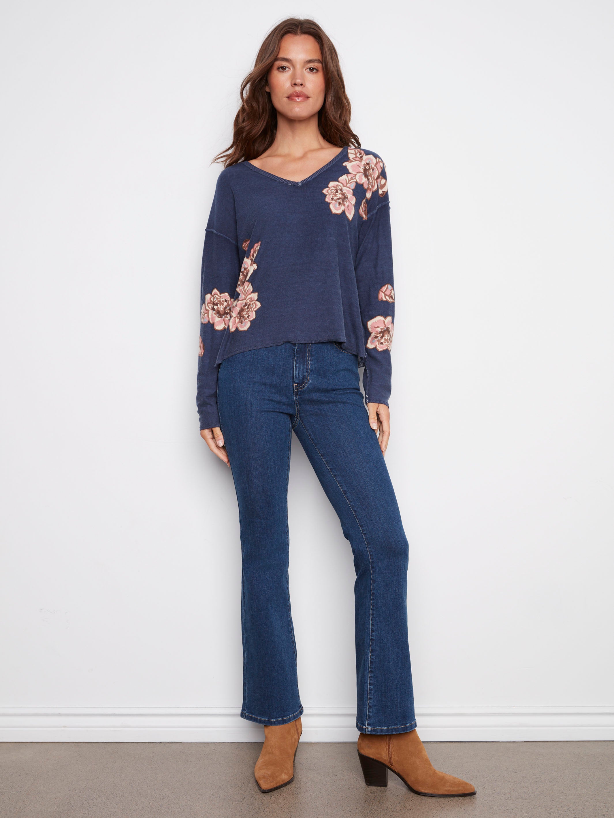 Relaxed fit denim blue sweater featuring a V-neck and floral accents, perfect for casual wear by Charlie B.