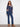 Relaxed fit denim blue sweater featuring a V-neck and floral accents, perfect for casual wear by Charlie B.