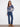 Reversible design in this denim blue sweater with long sleeves and floral motifs by Charlie B.