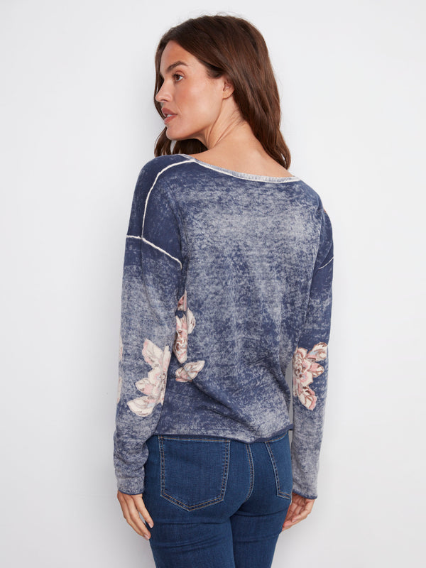 Long-sleeved reversible sweater in denim blue adorned with delicate floral patterns by Charlie B.