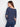 Chic relaxed fit V-neck sweater in denim blue featuring an elegant floral design by Charlie B.