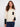 Ecru sweater with a classic crew neck design, featuring a stylish contrast black chest pocket for added flair by Charlie B.