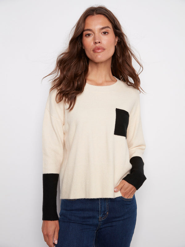 Ecru sweater with a classic crew neck design, featuring a stylish contrast black chest pocket for added flair by Charlie B.