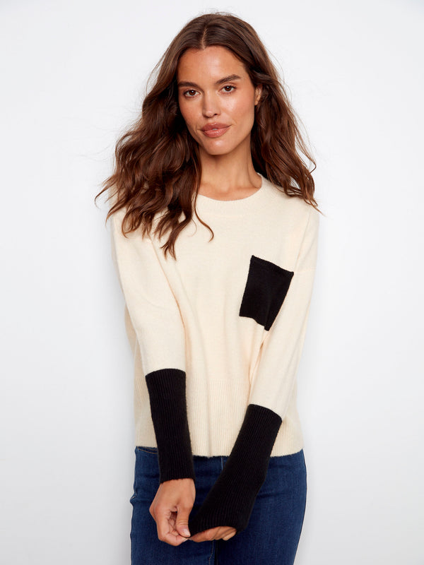 Ecru sweater showcasing elegant long sleeves and contrasting ribbed cuffs for a modern touch by Charlie B.