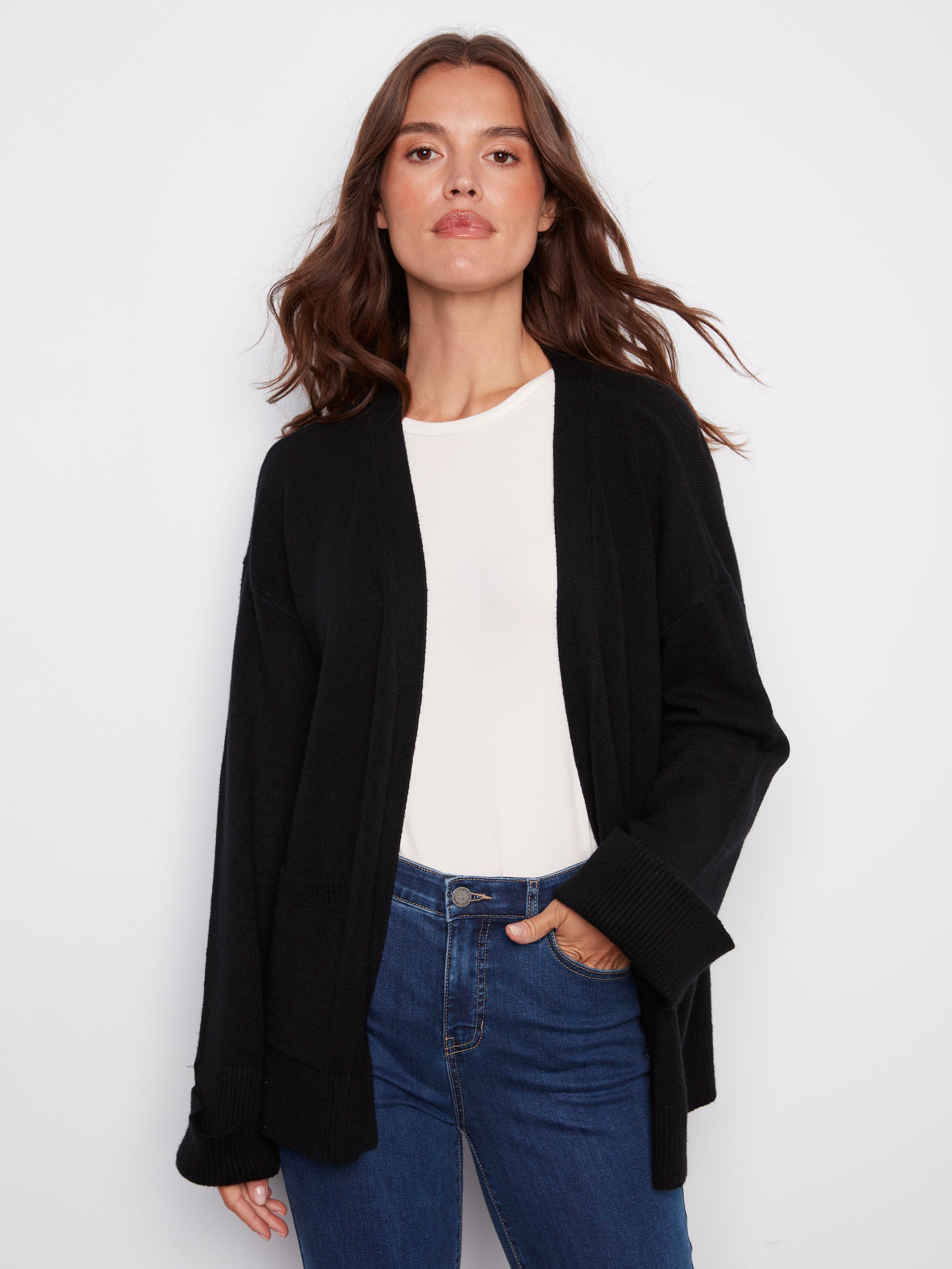 Black cardigan featuring wide cuffs and a relaxed fit, perfect for layering with any outfit by Charlie B.