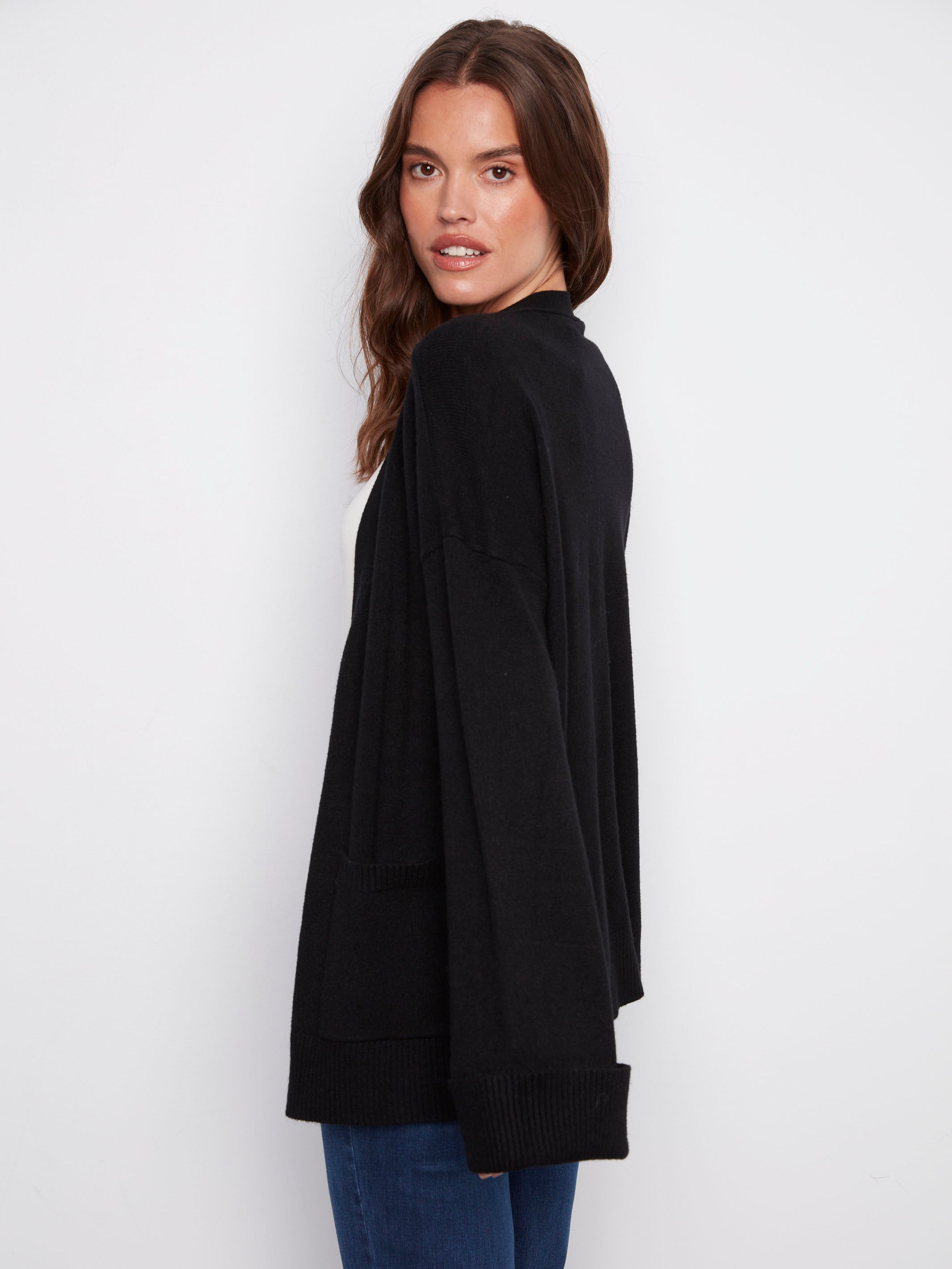 Elegant black long-sleeve cardigan highlighted by wide cuffs for a sophisticated look by Charlie B.