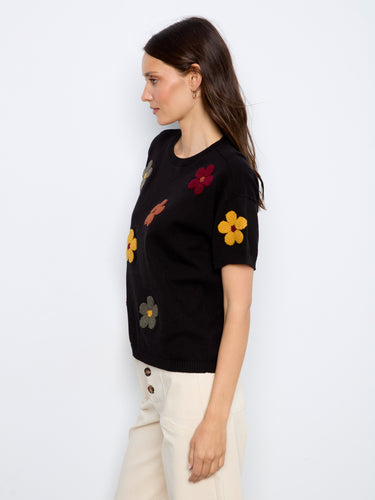 Chic black crew neck sweater with bold embroidered flowers for a stylish look by Charlie B.