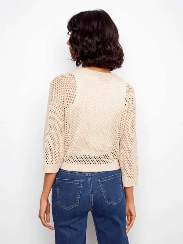 Elegant open-knit shrug with a shimmering finish, complete with elbow-length dolman sleeves by Charlie B.