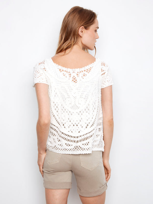 Scoop neckline gives this exquisite white crochet top an elegant silhouette, made with care by Charlie B.
