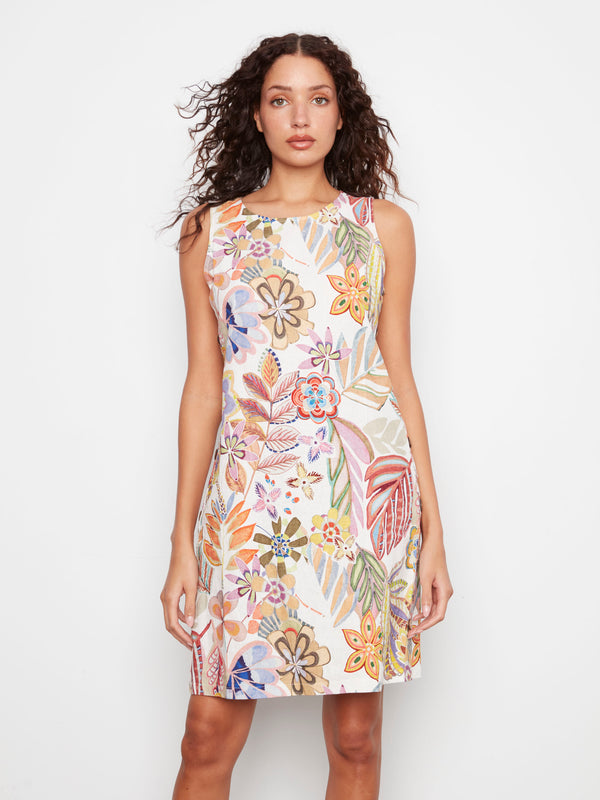 This dress showcases side button detail, adding a unique touch to the floral pattern. Ideal for summer events by Charlie B.