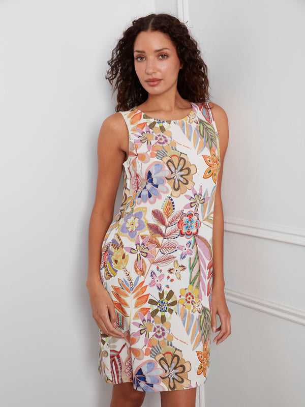 Side button detail adds charm to this knee-length floral dress, making it a standout piece in any collection by Charlie B.
