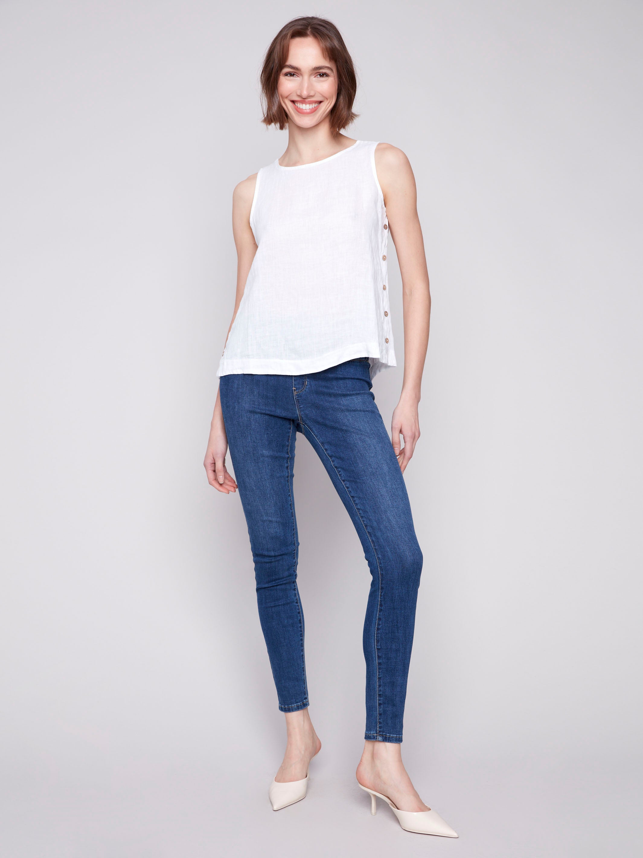 Elegant high-low hem on a white sleeveless tank by Charlie B.