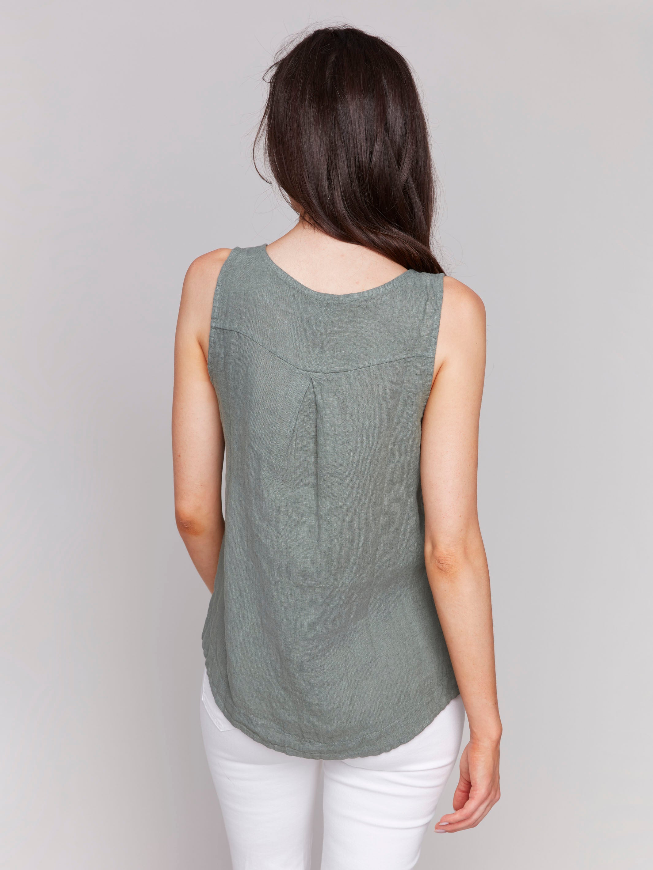 Tank top in celadon showcasing side button detailing by Charlie B.